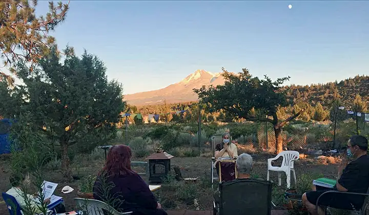 Outdoor gathering led by Willa Keizer at the foot of majestic Mount Shasta